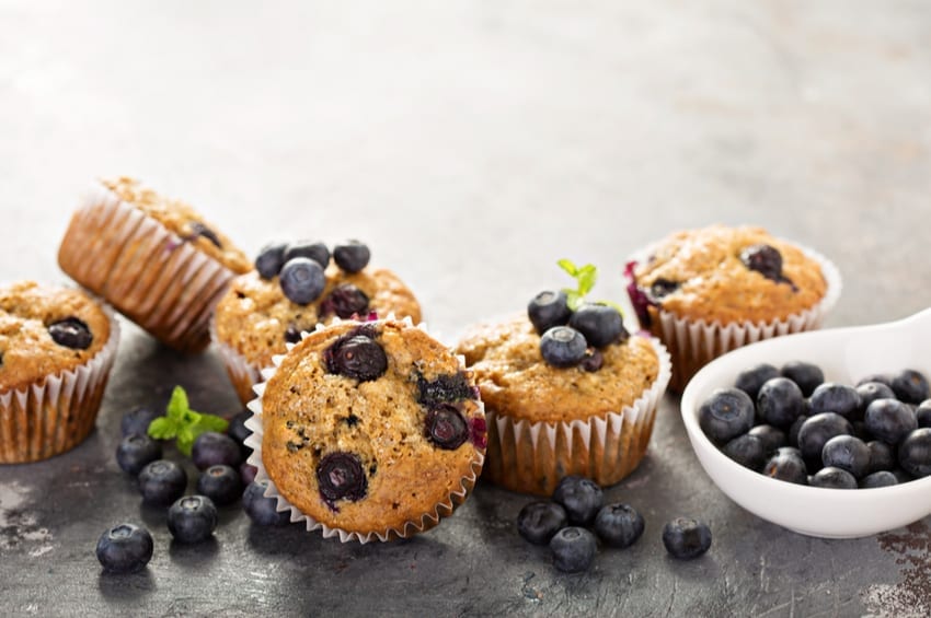 keto blueberry muffins topped with extra blueberries