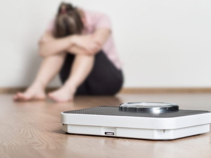 Woman discouraged by weighing herself too often